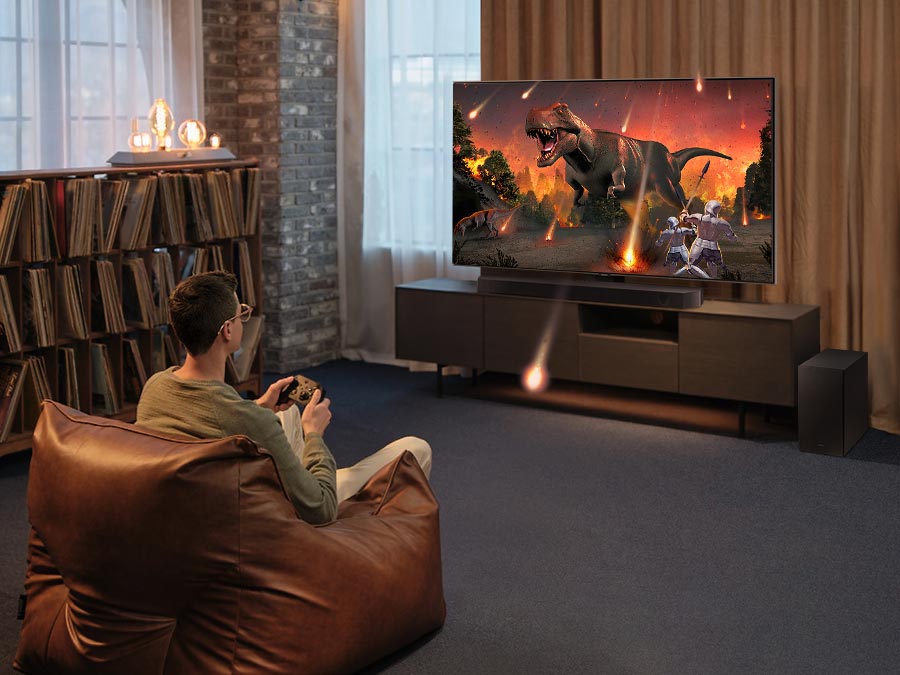 Samsung HW-Q600C установлен под телевизором в гостиной &mdash; домашний кинотеатр с объёмным звуком